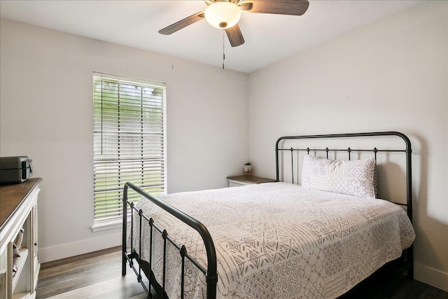 bedroom featuring hardwood / wood-style flooring and ceiling fan