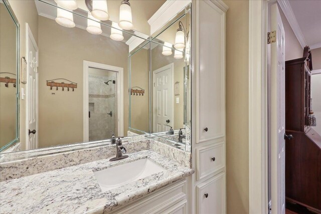 11 Regency Pl, Orange, TX 77630 - full bath featuring tiled shower, vanity, and ornamental molding