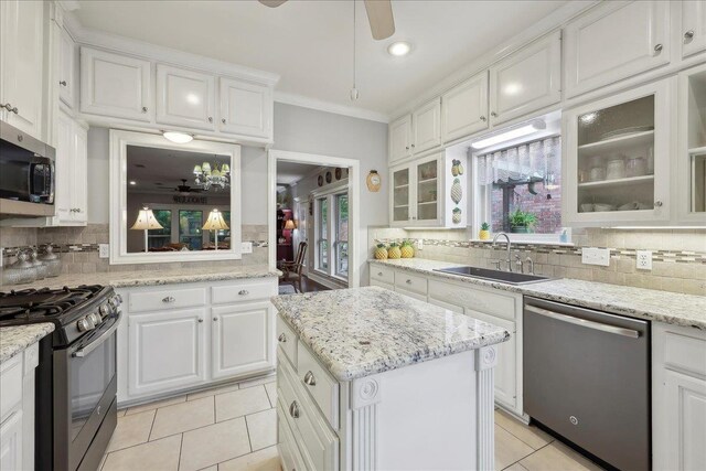 11 Regency Pl, Orange, TX 77630 - office space with built in desk, crown molding, dark wood-style flooring, ceiling fan, and baseboards