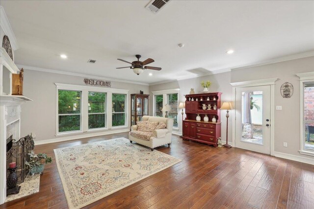 11 Regency Pl, Orange, TX 77630 - dining area featuring dark wood-type flooring, a ceiling fan, recessed lighting, a fireplace with flush hearth, and baseboards