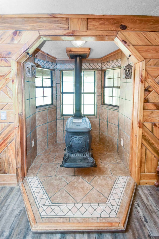 interior space featuring hardwood / wood-style flooring and a wood stove