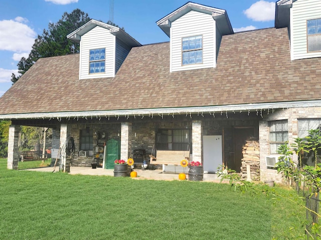 rear view of house with a lawn