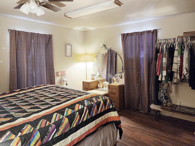 bedroom featuring ceiling fan and dark hardwood / wood-style flooring