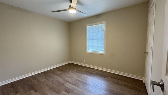 empty room with wood-type flooring, plenty of natural light, and ceiling fan