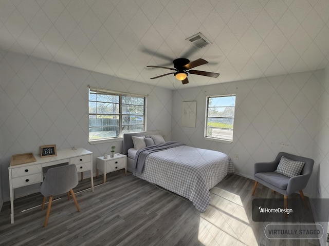 385 Warner St, Bridge City, TX 77611 - bedroom featuring dark wood-type flooring, multiple windows, and ceiling fan