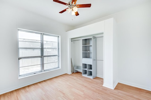 unfurnished bedroom featuring light hardwood / wood-style floors, a closet, and ceiling fan