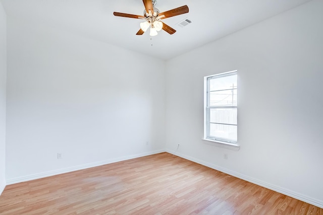 empty room featuring ceiling fan and light hardwood / wood-style flooring