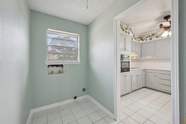 652 Birchwood Dr, Port Neches, TX 77651 - laundry area featuring electric dryer hookup, a textured ceiling, hookup for a washing machine, light tile patterned floors, and ceiling fan