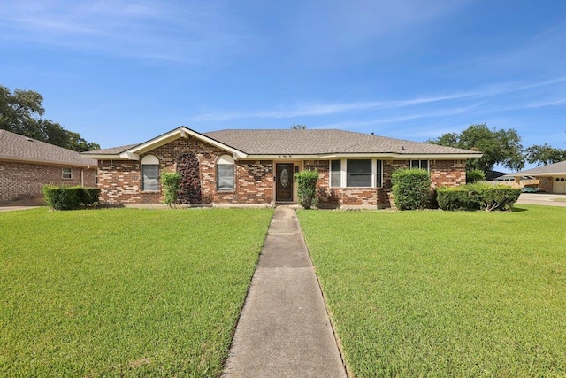 652 Birchwood Dr, Port Neches, TX 77651 - ranch-style home featuring a front yard, brick siding, and a shingled roof