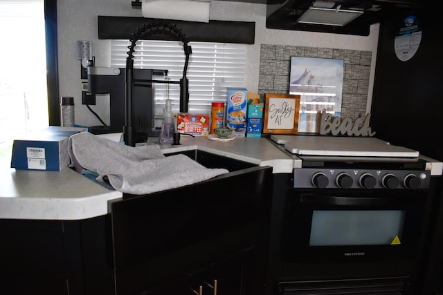 kitchen featuring black range with electric stovetop