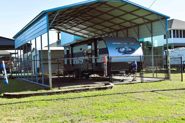 exterior space with driveway, fence, and a carport