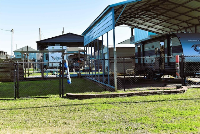 communal playground featuring a lawn and fence