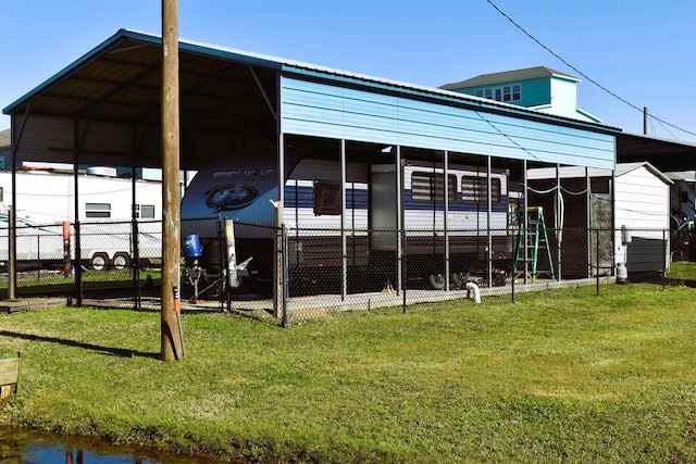 exterior space with a carport and fence