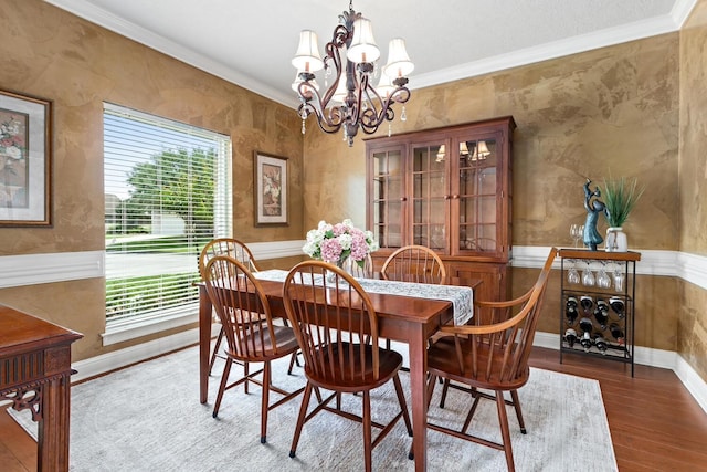 2425 Amberwood Dr, Beaumont, TX 77713 - dining area with a wealth of natural light, ornamental molding, wood finished floors, and a chandelier