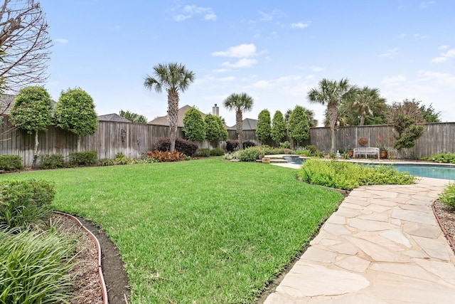2425 Amberwood Dr, Beaumont, TX 77713 - view of yard with a fenced in pool and a fenced backyard