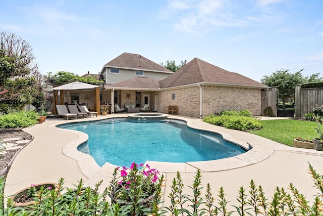 2425 Amberwood Dr, Beaumont, TX 77713 - view of pool with a pool with connected hot tub, fence, and a patio area