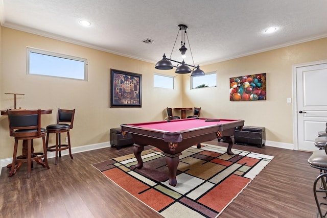 2425 Amberwood Dr, Beaumont, TX 77713 - rec room with visible vents, ornamental molding, and wood finished floors