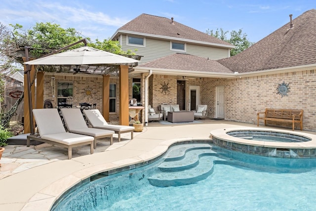 2425 Amberwood Dr, Beaumont, TX 77713 - back of house featuring ceiling fan, brick siding, an outdoor hangout area, a patio, and a shingled roof