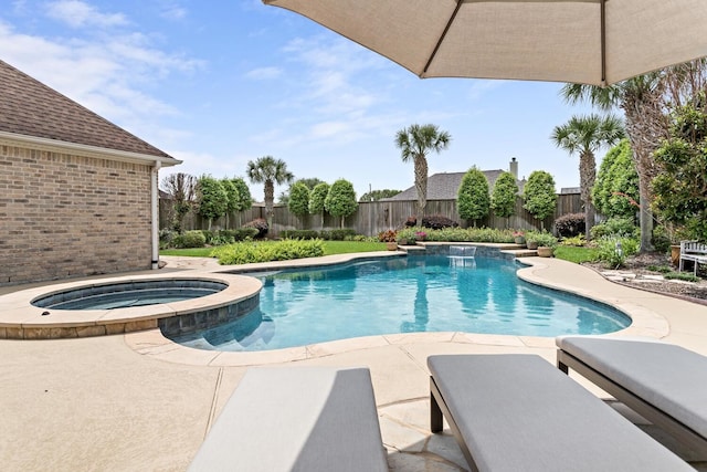2425 Amberwood Dr, Beaumont, TX 77713 - view of swimming pool featuring a patio, an in ground hot tub, a fenced in pool, and a fenced backyard