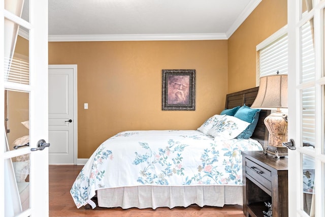 2425 Amberwood Dr, Beaumont, TX 77713 - bedroom with crown molding, baseboards, and wood finished floors