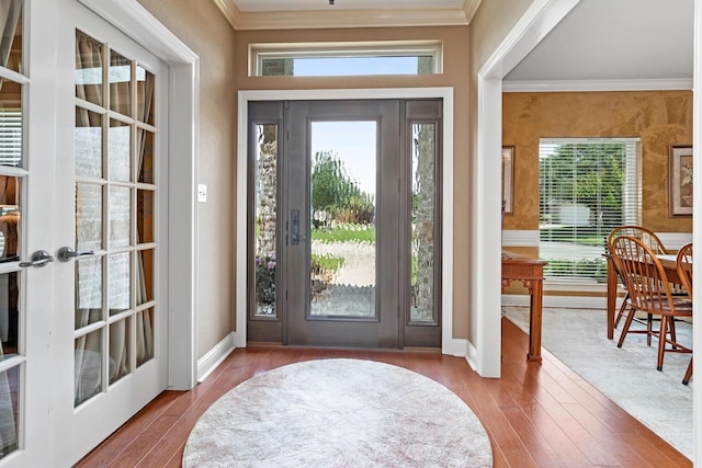 2425 Amberwood Dr, Beaumont, TX 77713 - entrance foyer featuring crown molding, wood finished floors, and french doors