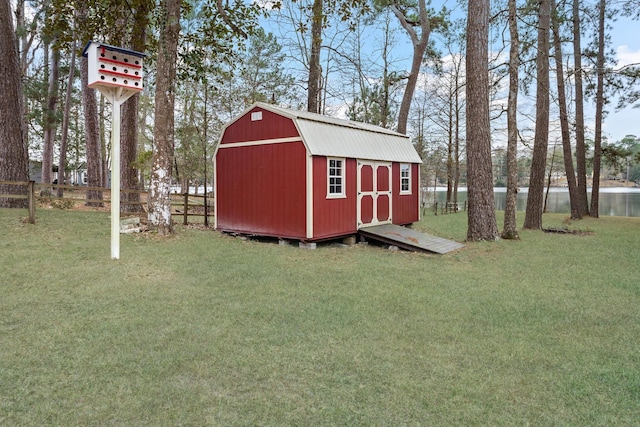 view of shed with a water view