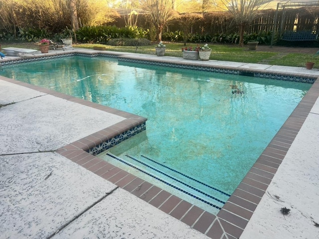 outdoor pool featuring a patio area