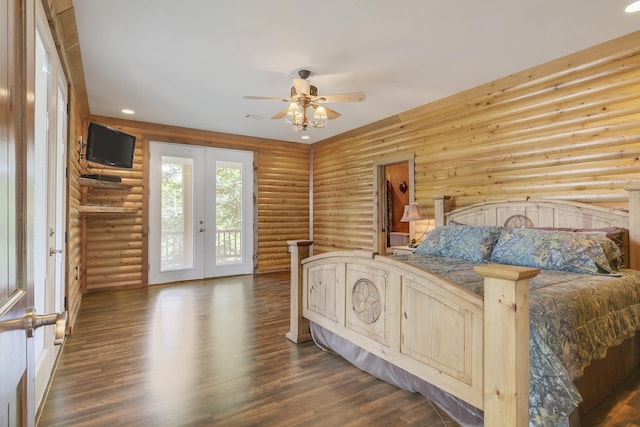 bedroom with rustic walls, ceiling fan, french doors, access to exterior, and dark wood-type flooring