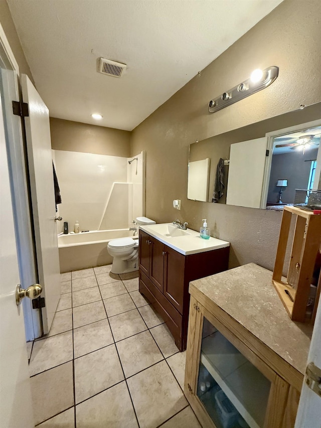 197 Osborne Dr, Bridge City, TX 77611 - bathroom with toilet, vanity, tile patterned floors, and  shower combination