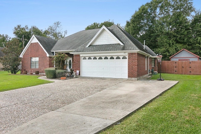 view of front of home with a front yard and a garage