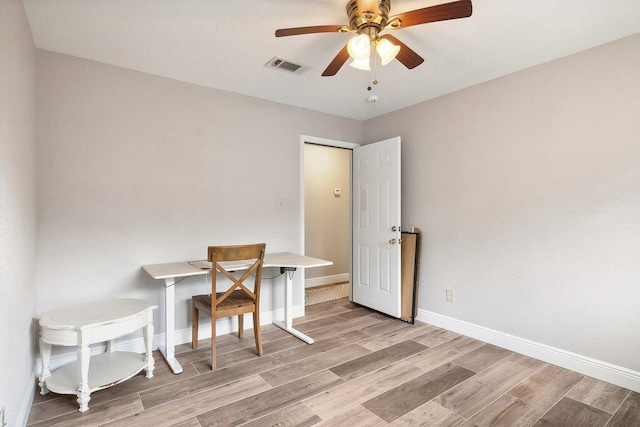 interior space with ceiling fan and light hardwood / wood-style floors