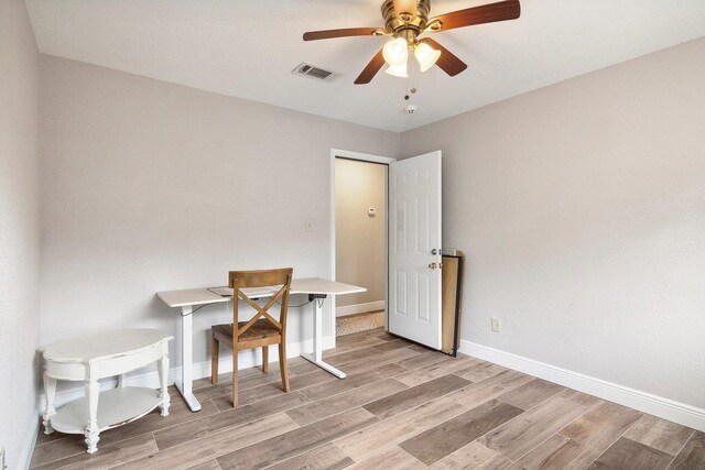 interior space with ceiling fan and light hardwood / wood-style floors