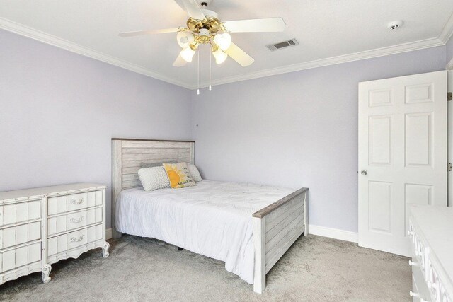 bedroom with ceiling fan, light colored carpet, and crown molding