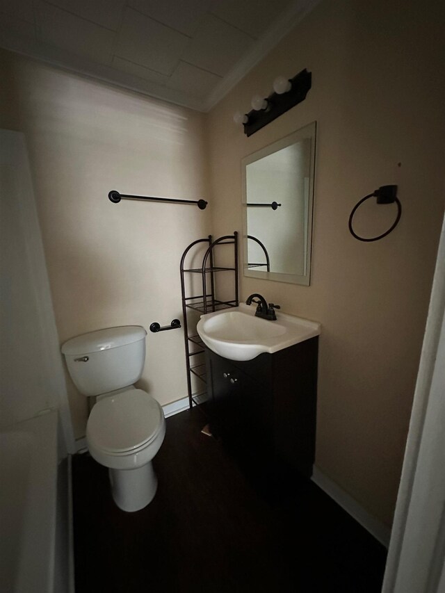 410 N 6th St, Silsbee, TX 77656 - bathroom with vanity, a bath, and wood finished floors