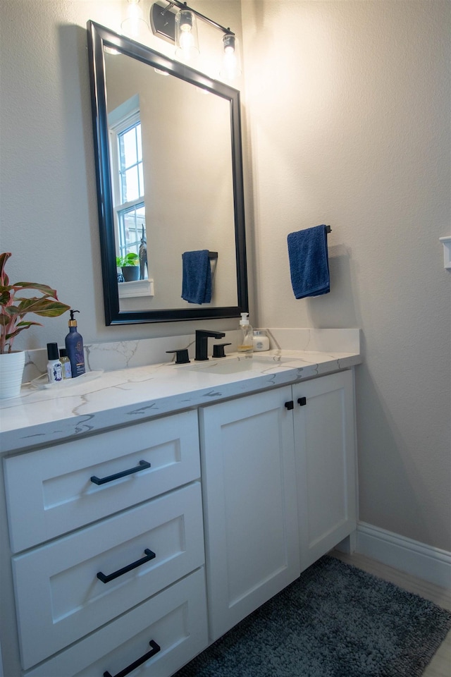 245 Balsam Bnd, Lumberton, TX 77657 - bathroom featuring vanity and baseboards