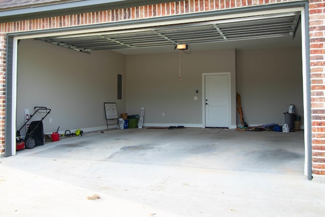 245 Balsam Bnd, Lumberton, TX 77657 - garage with a garage door opener, concrete driveway, and electric panel