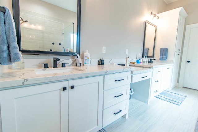 245 Balsam Bnd, Lumberton, TX 77657 - bathroom with double vanity and a tile shower