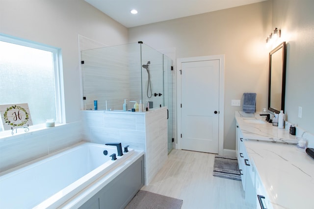 245 Balsam Bnd, Lumberton, TX 77657 - full bath with double vanity, a stall shower, a garden tub, and recessed lighting