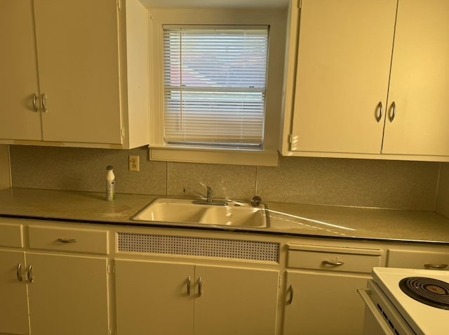 kitchen featuring sink and decorative backsplash