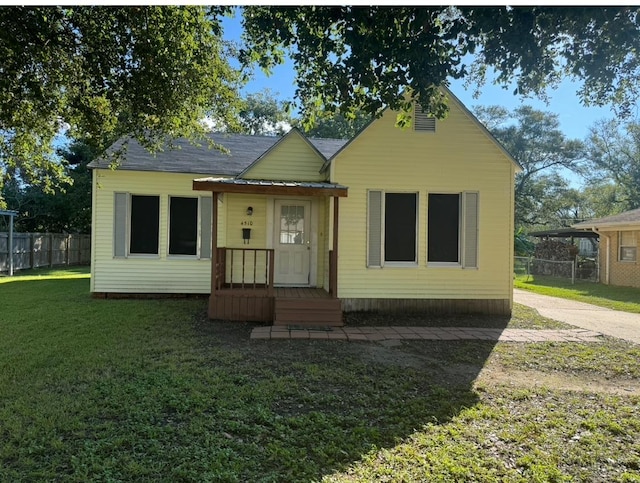 bungalow with a front yard