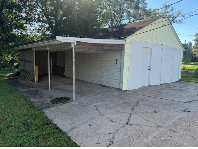 view of outbuilding with a carport