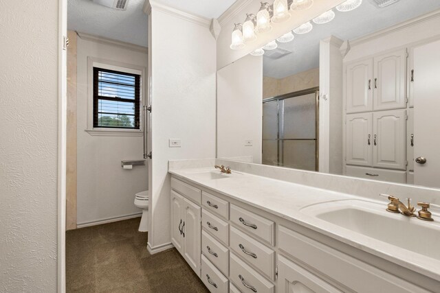 1911 Huntsman St, Orange, TX 77632 - bathroom with double vanity, toilet, a stall shower, ornamental molding, and baseboards