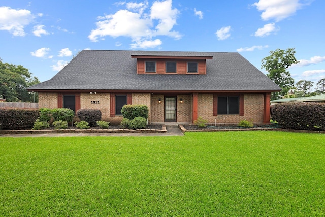 1911 Huntsman St, Orange, TX 77632 - view of front of property featuring brick siding, a front yard, and a shingled roof