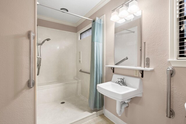 1911 Huntsman St, Orange, TX 77632 - bathroom featuring crown molding, a shower stall, tile patterned floors, and a textured wall