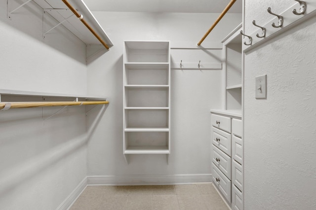1911 Huntsman St, Orange, TX 77632 - spacious closet with light tile patterned floors