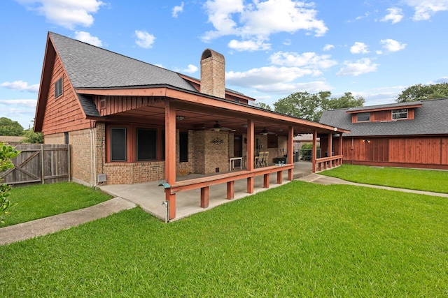 1911 Huntsman St, Orange, TX 77632 - back of property featuring ceiling fan, a chimney, a patio, a shingled roof, and brick siding