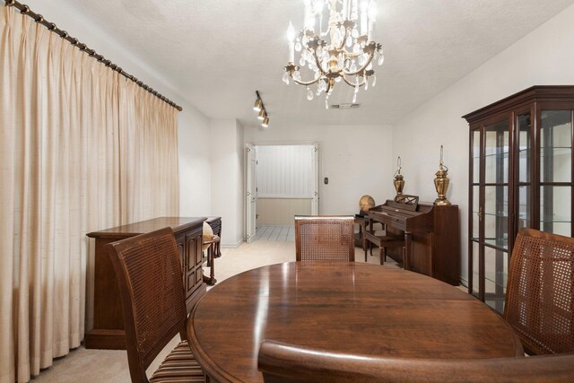 1911 Huntsman St, Orange, TX 77632 - dining room featuring light colored carpet and a chandelier