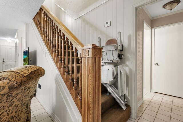 1911 Huntsman St, Orange, TX 77632 - stairway featuring tile patterned floors and ornamental molding