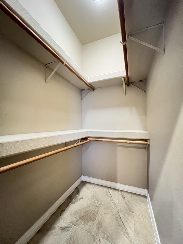 spacious closet with built in desk