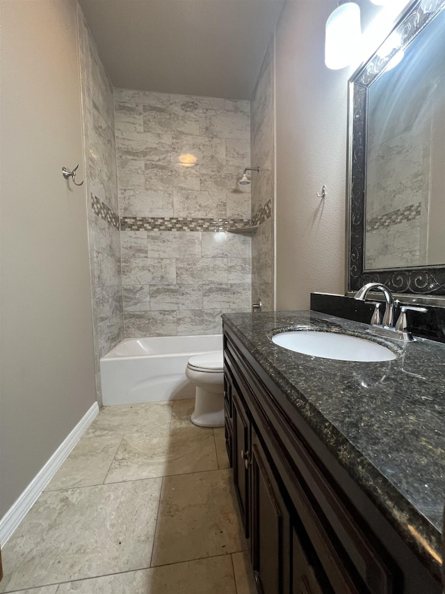 full bathroom featuring vanity, toilet, and tiled shower / bath